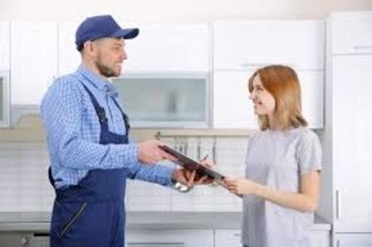 Plumber with customer
